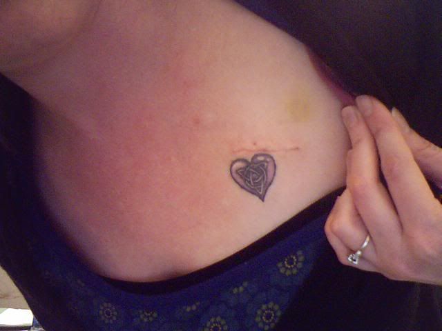 Yes I do have a sweet little tattoo of a purple heart with a celtic knot 